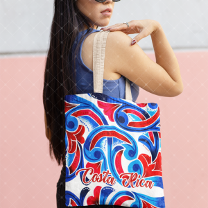 Tote bag con diseño rojo, azul y blanco inspirado en la carreta típica costarricense.